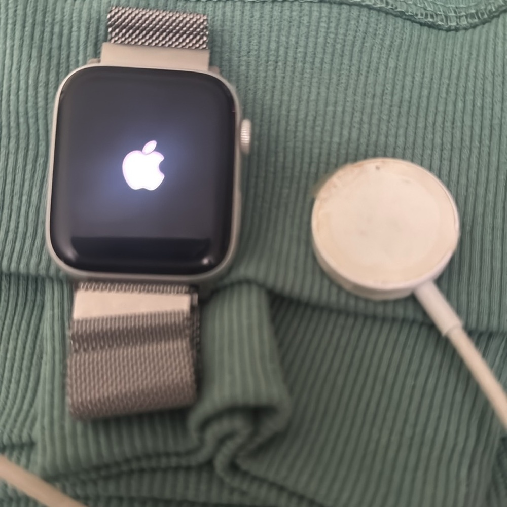 Series 4, 44 mm Apple Watch with charger.